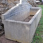 The wall of the compartment on the right end is slightly raised above the base of the trough, which would allow the contents of the trough to flow underneath it. The changes in colour again show that there has been different levels of contents in the trough. 