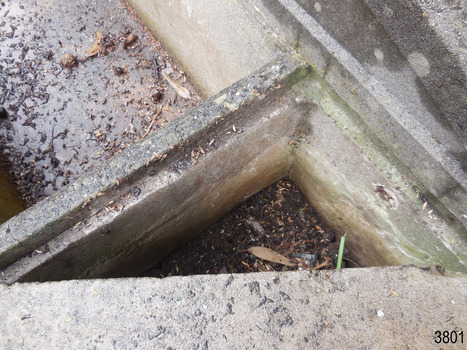 In the centre of the back wall there appears to be the remains of a metal fitting. 