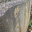 The embedded metal slightly juts out from the concrete wall.