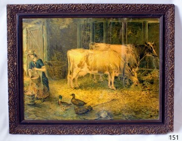 Framed picture of farm scene of woman and animals in a barn