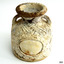 Front of vase has oval flat shape where a label of motif could be attached