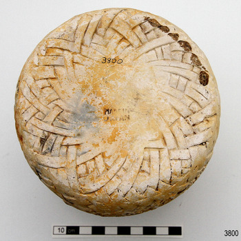 Base of vase has remnants of stamped text