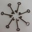 Seven keys in a circle with handles on the outside and ends in centre