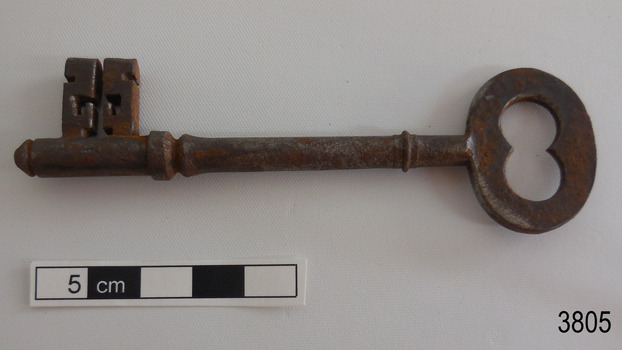 Other side of iron latch key with oval handle