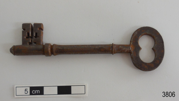 Other side of iron latch key with oval handle