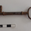 Other side of iron latch key with oval handle