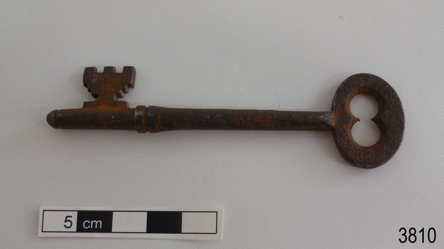 Other side of iron latch key with oval handle