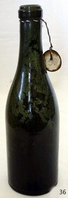 Green glass bottle with tag and push up boase
