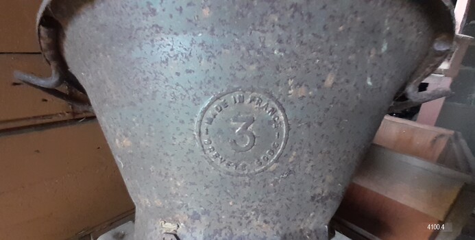 Mill has maker's emblem with text in French