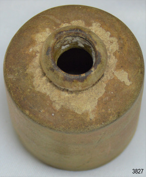 Brown clay bottle has round mouth with rolled lip