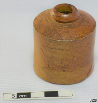 Brown clay bottle with short, narrow neck