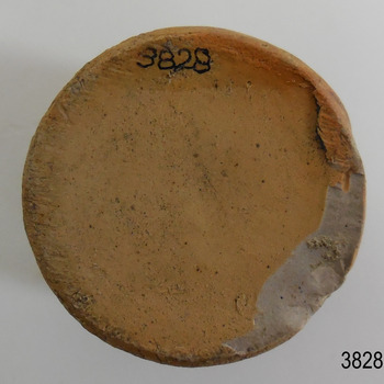 Flat base of bottle has a large chip on the edge