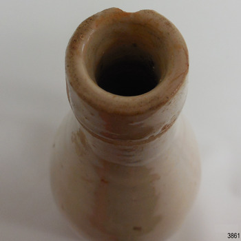 Close-up of round open mouth of bottle