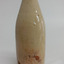 Glaz3d ceramic bottle with brown discolouration on surface in places