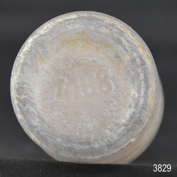 Base of bottle has an inscription embossed