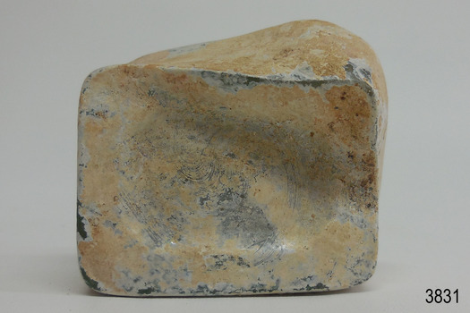 Base of bottle is indented and creased