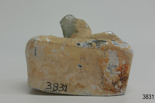 Neck and mouth of bottle are tilted to the side
