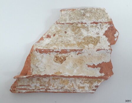 Tile is almost completely covered in encrustations