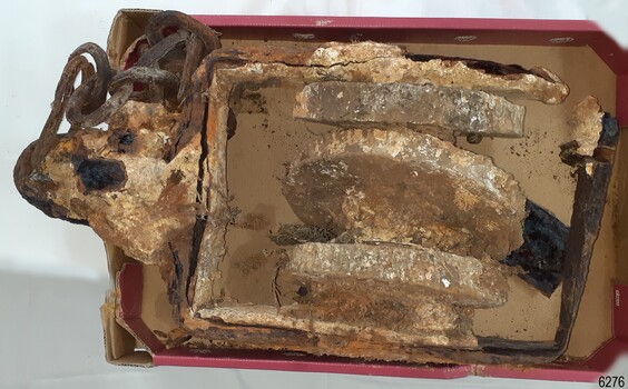 Block is encrusted. It still has a piece of chain attached