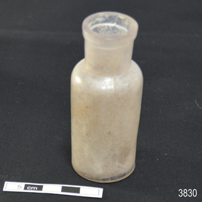 Clear glass bottle has white residue inside