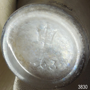 Base of bottle has a 'crown logo and also has numbers