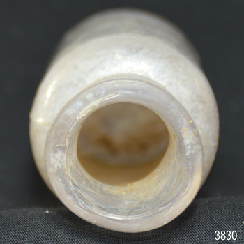 Mouth of bottle has small chips in the glass