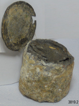 Bottle seal's underside is also covered with encrustation