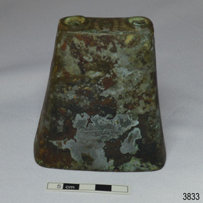 Side has remnant of inscription. No handle on bell.