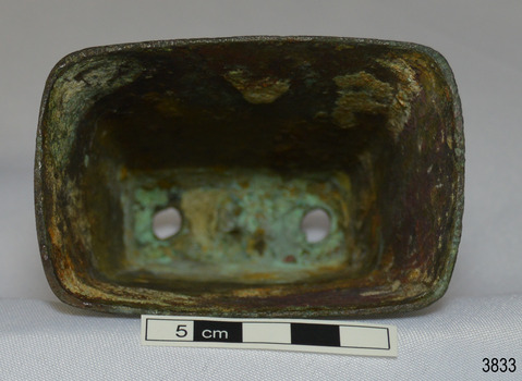 Base has rounded corners and flares inwards to top. There is no clanger inside bell.