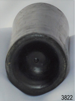 Narrow heel, deep pushed up base, pontil mark in centre. Body has bumpy texture.