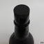 Stopper is black, has dimpled top and corrugated edges