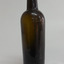 Light shining through shows brown glass. Some horizontal blow-lines around base. Shine on surface.