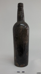 Bottle has scratches and marks on surface.