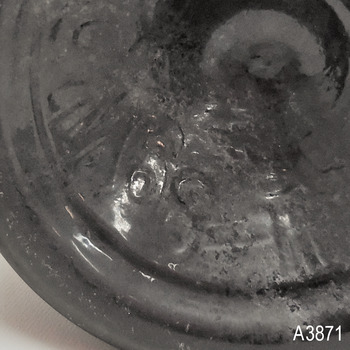 Over-embossed base, note the 6 and the T are doubled up