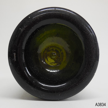 Base has indented centre with pontil mark. Rectangular indent also on heel.