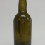 Bottle is shiny from top to below shoulder, then is matt. Sediment can be seen on the inside.