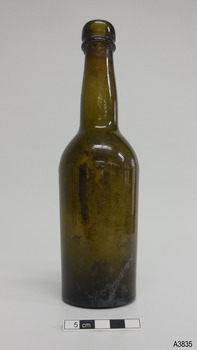 Bottle is shiny from top to below shoulder, then is matt. Sediment can be seen on the inside.