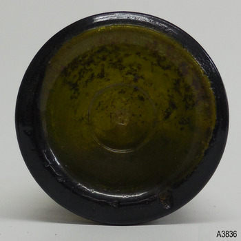 Base has thick heel, ring around centre pontil mark