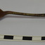 Spoon has deep bowl and rounded end on handle. Metal is discoloured.