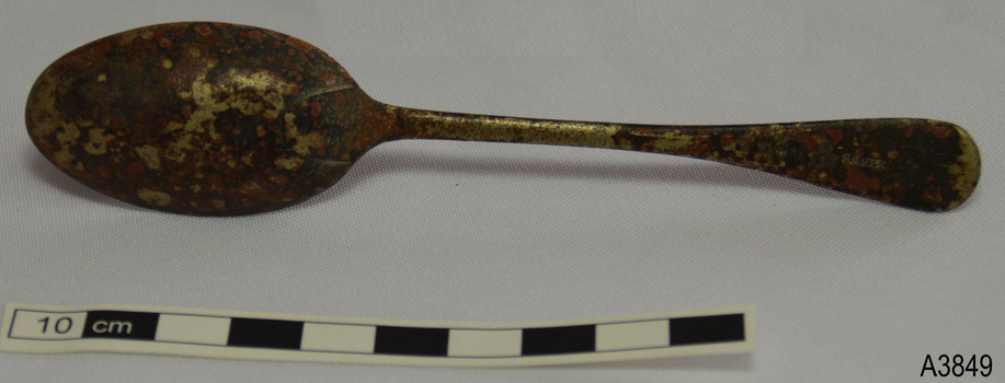 Spoon's neck has a curved shape just below the collar. Some shiny metal remains. Embossed marks on end of handle.