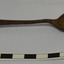 Spoon is dar coloured and bowl is at about 45 degrees angle