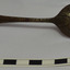 Spoon is brown with remnants of silver. Handle tip has rounded 'M' shepe of Old English design.