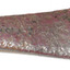 Logo and embossed marks are worn but visible. Discolouration of brown, red, light and dark. Handle has rounded tip.
