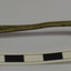 Spoon has a silver-bronze colour with black marks on the surface