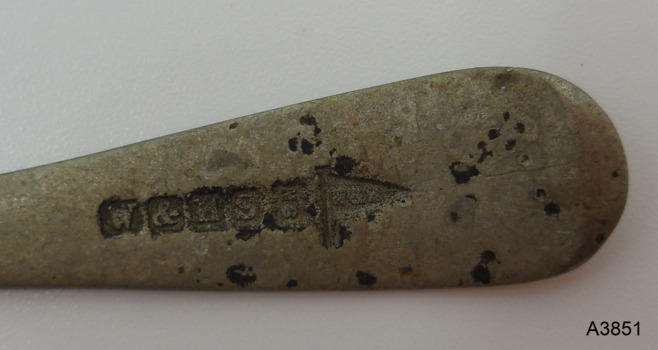 Row of six engraved inscriptions with letters and symbols