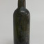 Bottle is dark olive green, round, tall and slim.
