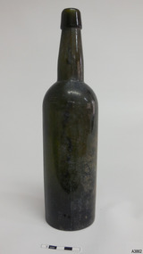 Bottle is dark olive green, round, tall and slim.