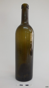 Tall slim cylindrical bottle, dark green glass