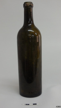 Tall slim cylindrical bottle, dark green