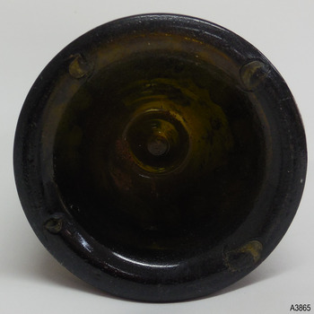 Base has pontil mark in centre and four pontil marks around the heel